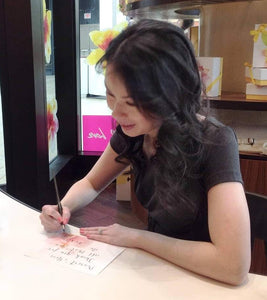 Barbara Kua at on site calligraphy event in Toronto