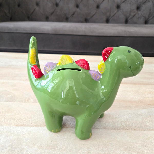 Green dinosaur-shaped piggy bank