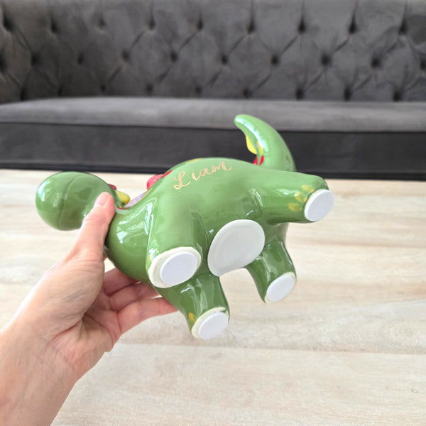 Green dinosaur piggy bank
