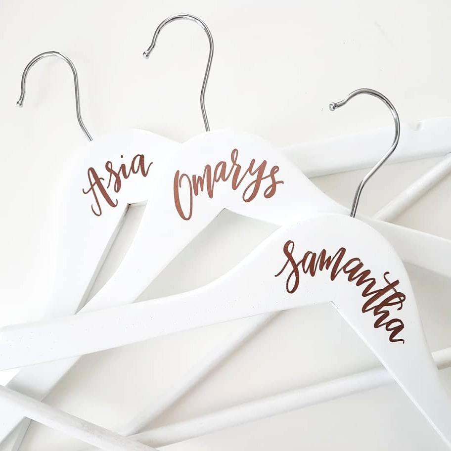 White personalized bridesmaid hangers